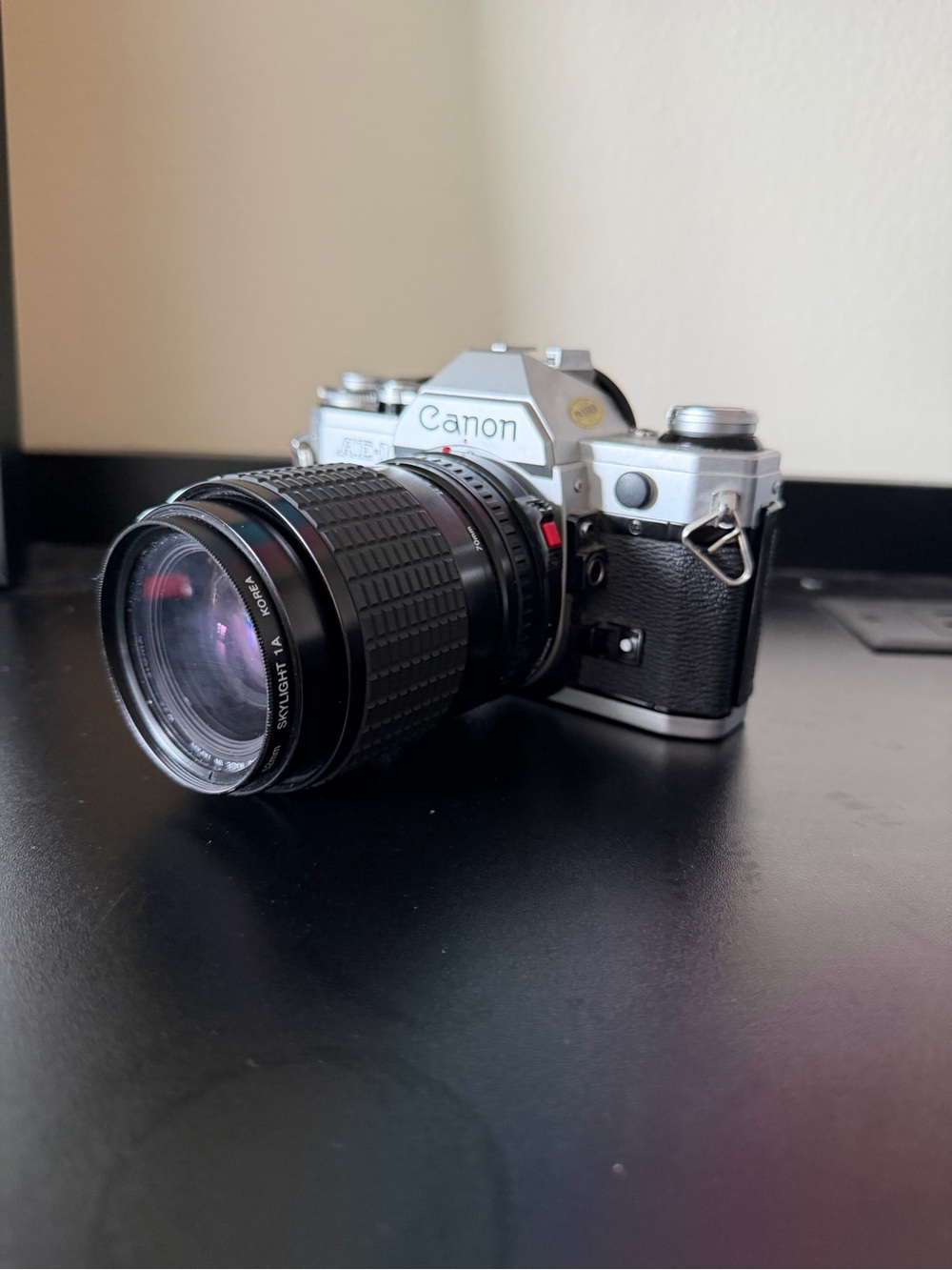 AE 1Canon Silver and Black Film with Black Zoom Lens